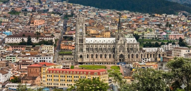 Gothic cathedral surrounded by colorful city buildings