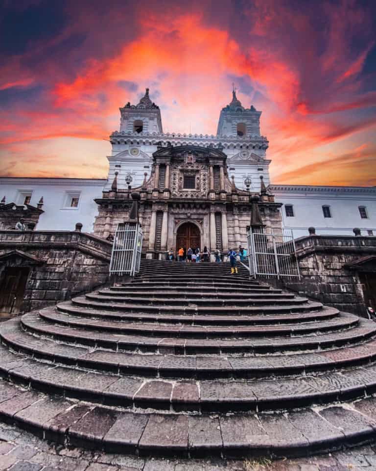 Historic church with dramatic sunset sky