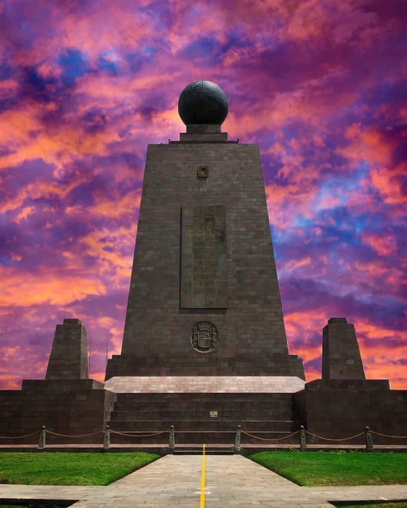 Equatorial monument under vibrant purple and orange sky