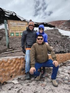 People posing at Refugio José Rivas in mountains